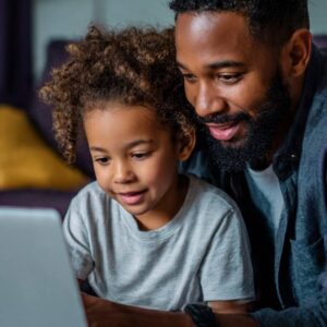 Parents helping children with digital learning